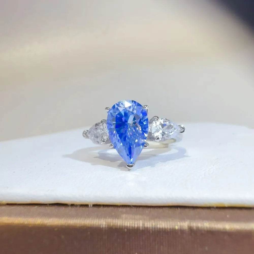 2 Carat Blue Moissanite Ring - Sterling Silver Pear Cut Three Stone Design - Patelcreations