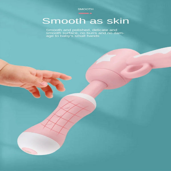 Pink baby rattle with text about its smooth surface on a teal background