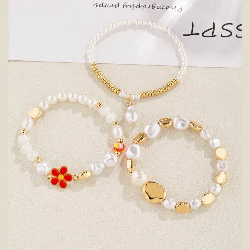 Pearl & Gold Bracelet Set - 3 Piece White Pearl Stack with Flower Charm & Heart Accents - Patelcreations