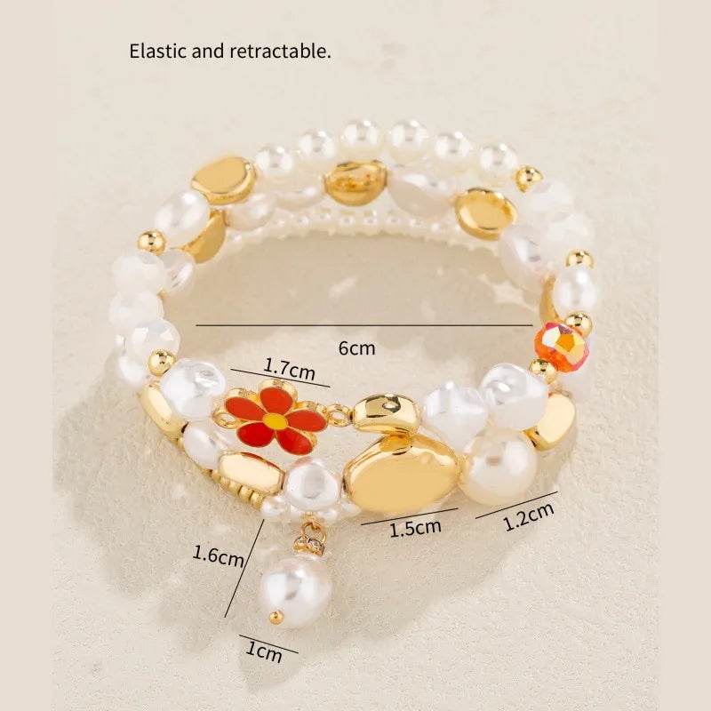 Pearl & Gold Bracelet Set - 3 Piece White Pearl Stack with Flower Charm & Heart Accents - Patelcreations